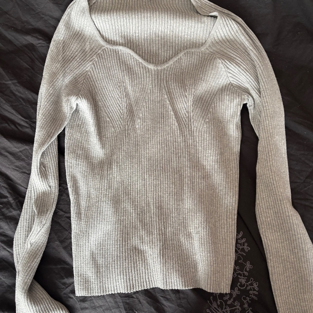 Gray sweater from one of the automatic box companies